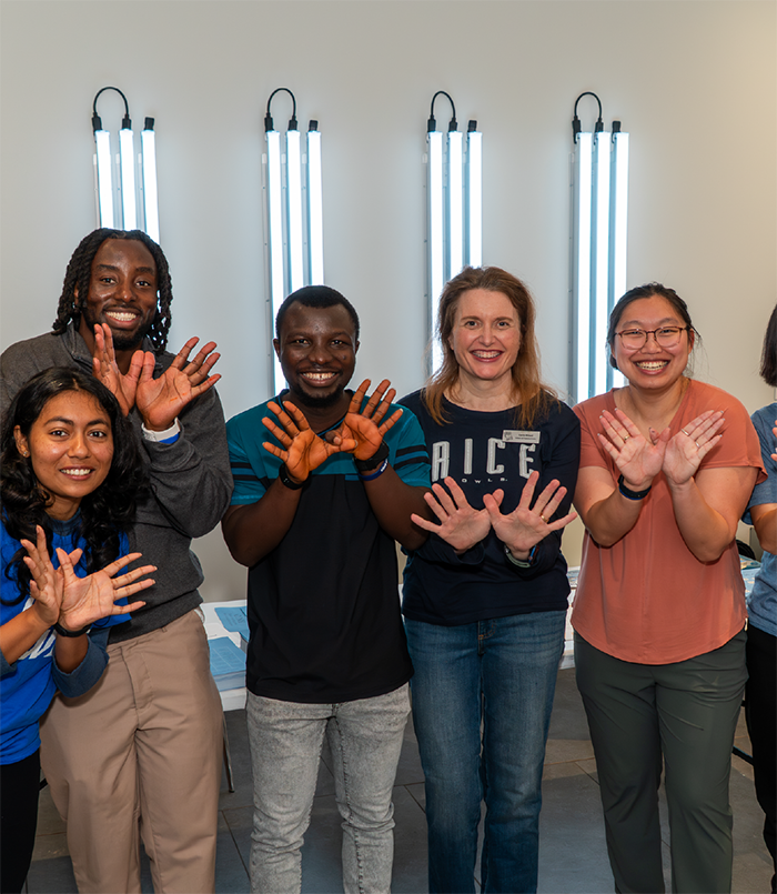 Students making the Owl sign