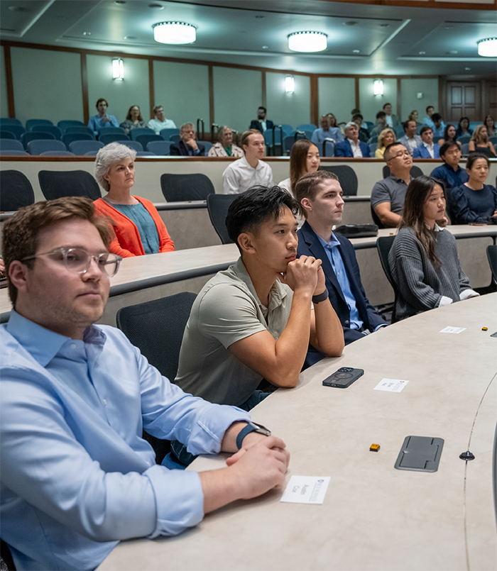 Attendees listening to a professional education seminar