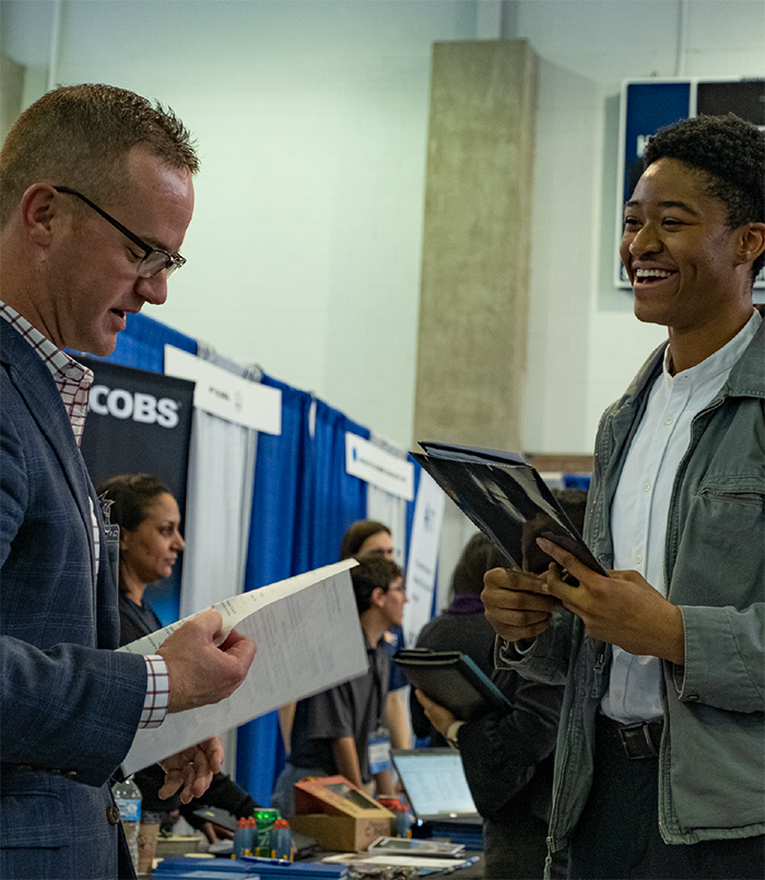 Student having a conversation with a recruiter